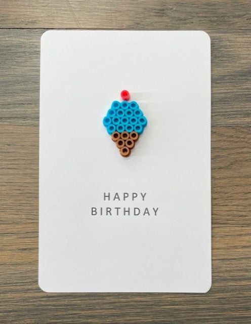 Picture of a Happy Birthday card with a blue ice cream cone on it