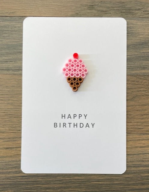 Picture of a Happy Birthday card with a pink ice cream cone on it